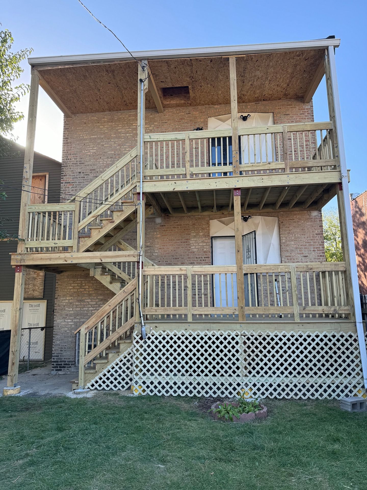 Rebuilt three flat porch system with new framing, stairs and guardrails